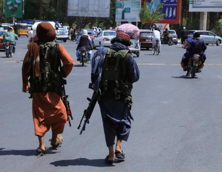 Taliban forces patrol a street in Herat, Afghanistan August 14, 2021.