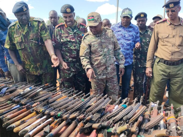 Rift Valley Region Police commander Tom Odera DIG-APS Noor Gabow and Interior CS Kithure Kindiki assessing the firearms recovered in the North Rift